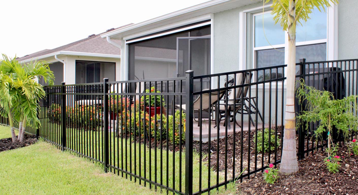 Aluminum fence installed by Eagle Fence behind home