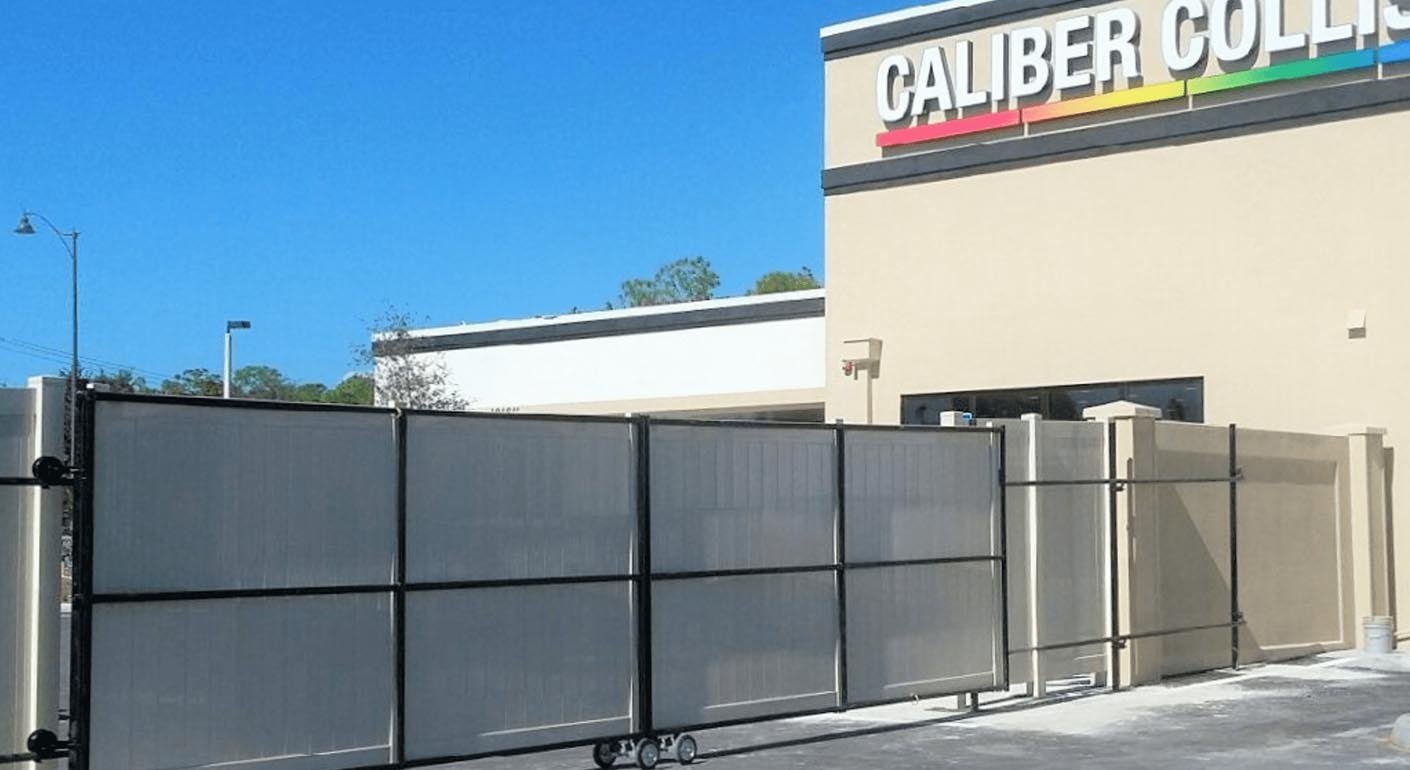 Commercial privacy fence and gate at collision shop in fort myers