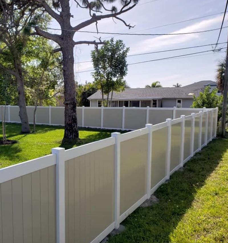 2 tone vinyl fence installation by Eagle Fence