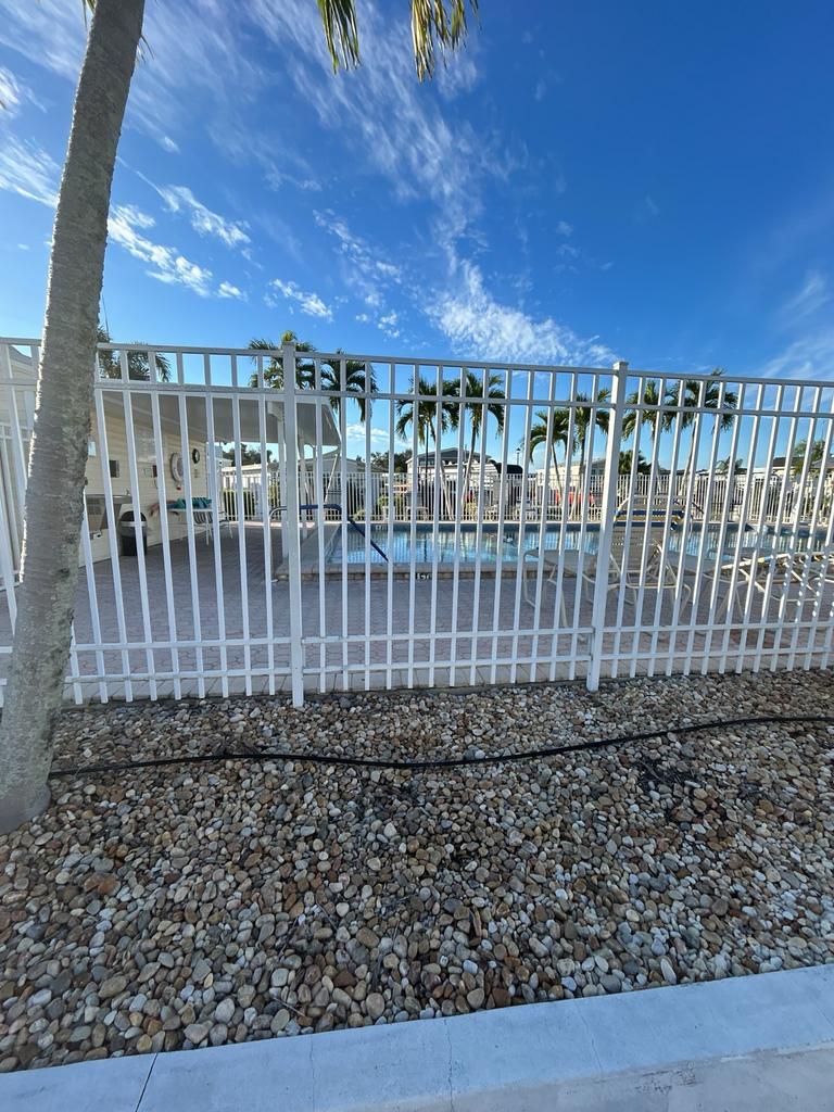 while aluminum fence install completed